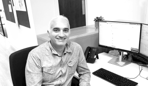 George Chatzikostis at his desk, Austin-Smith:Lord studio