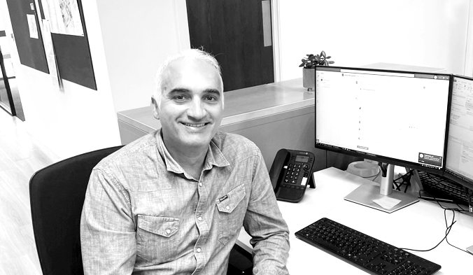 George Chatzikostis at his desk, Austin-Smith:Lord studio